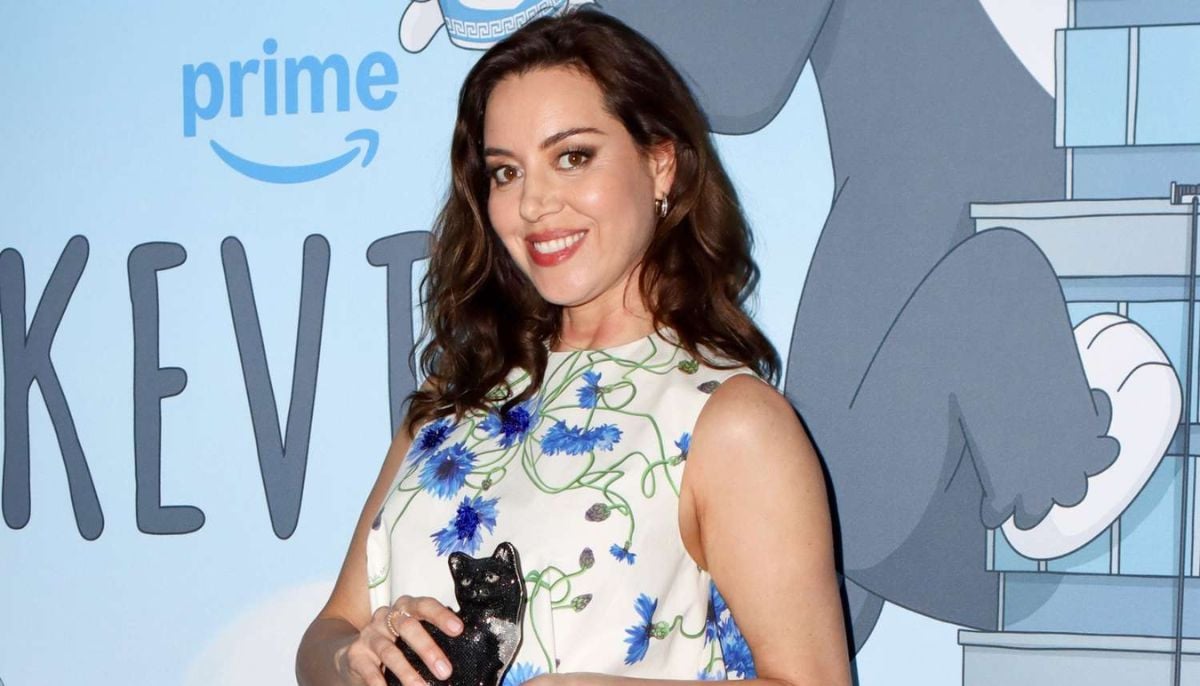 Aubrey Plaza tenderly cradles baby bump during sweet NYC outing
