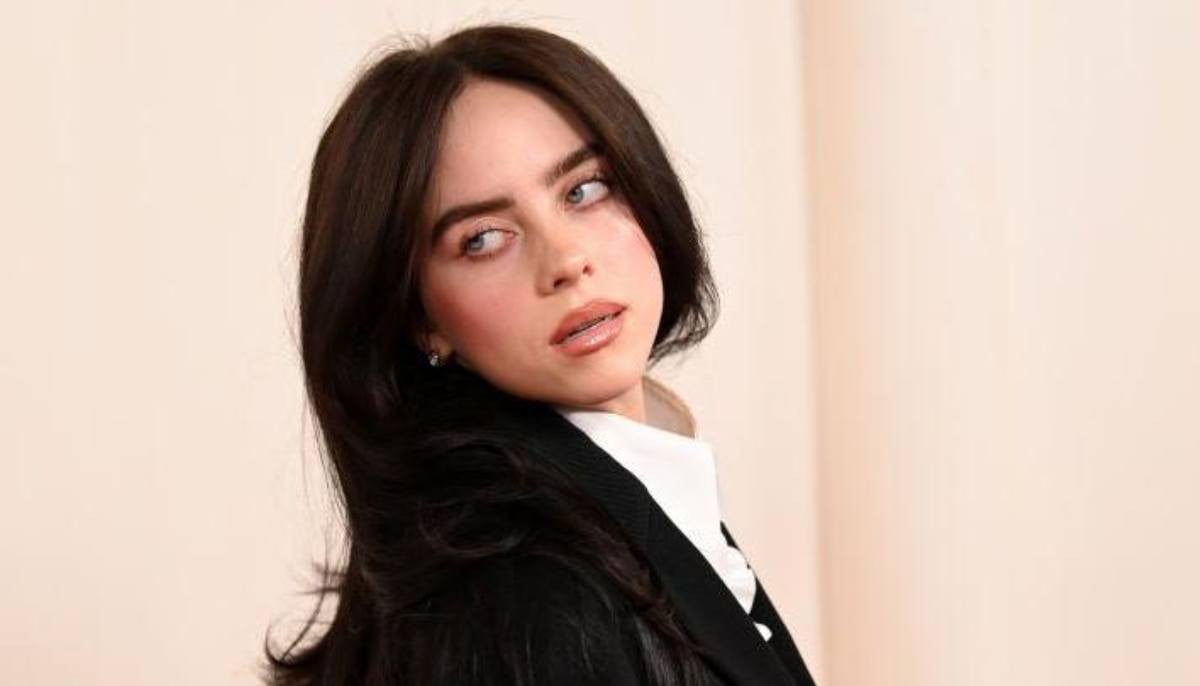 Billie Eilish wows in red hair amid film production