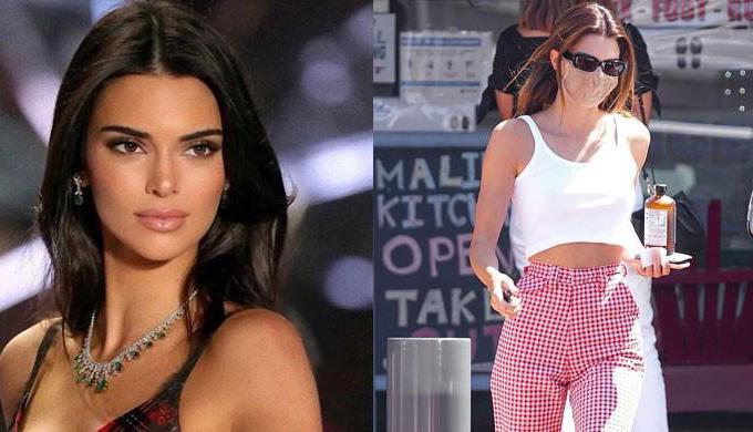 Kendall Jenner dazzles in red print pants with a cropped white tank top