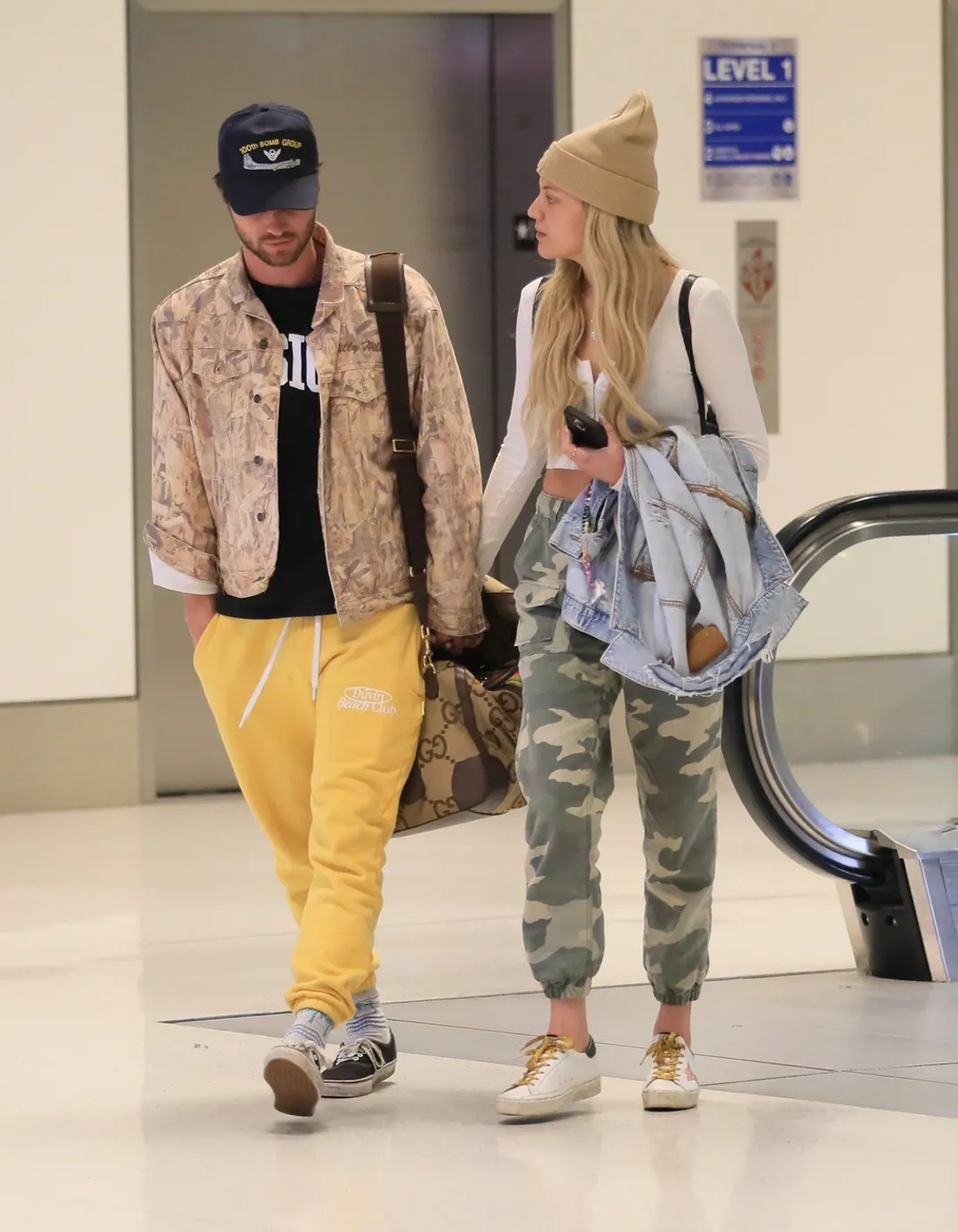 Kelsea Ballerini, Chase Stokes can't keep hands off each other at LAX: See