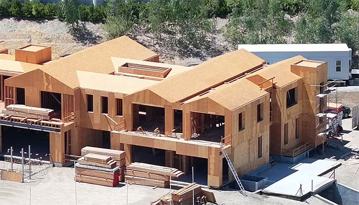 Wooden board stacks point to ongoing construction at Kylie Jenners 3rd home.