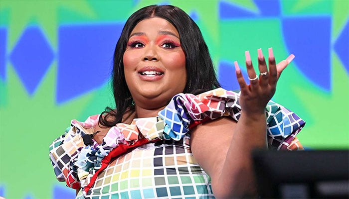 Lizzos Big Grrl and Big Boiii dancers rally around her amid lawsuit.