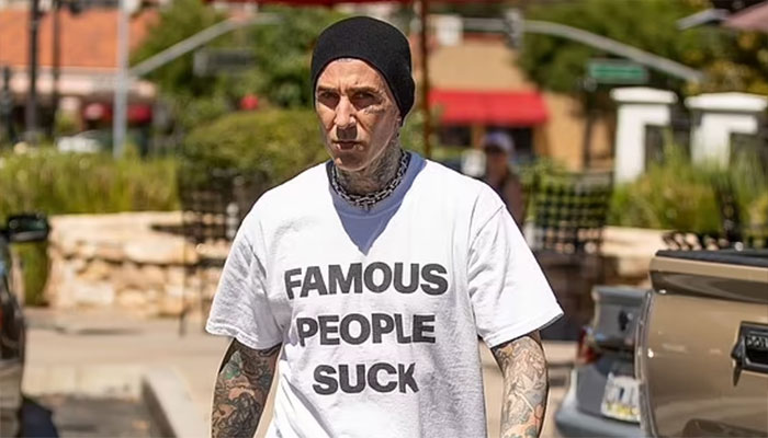 Travis Barker sports Famous People Suck tee during Calabasas lunch outing.