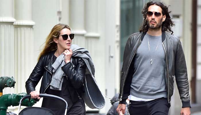 Russell Brand’s wife Laura Gallacher is ‘standing by her man’