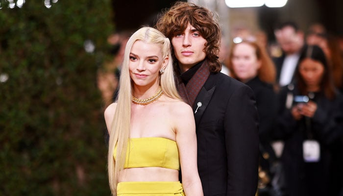 Anya Taylor-Joy and Malcolm McRae exchange vows surrounded by loved ones