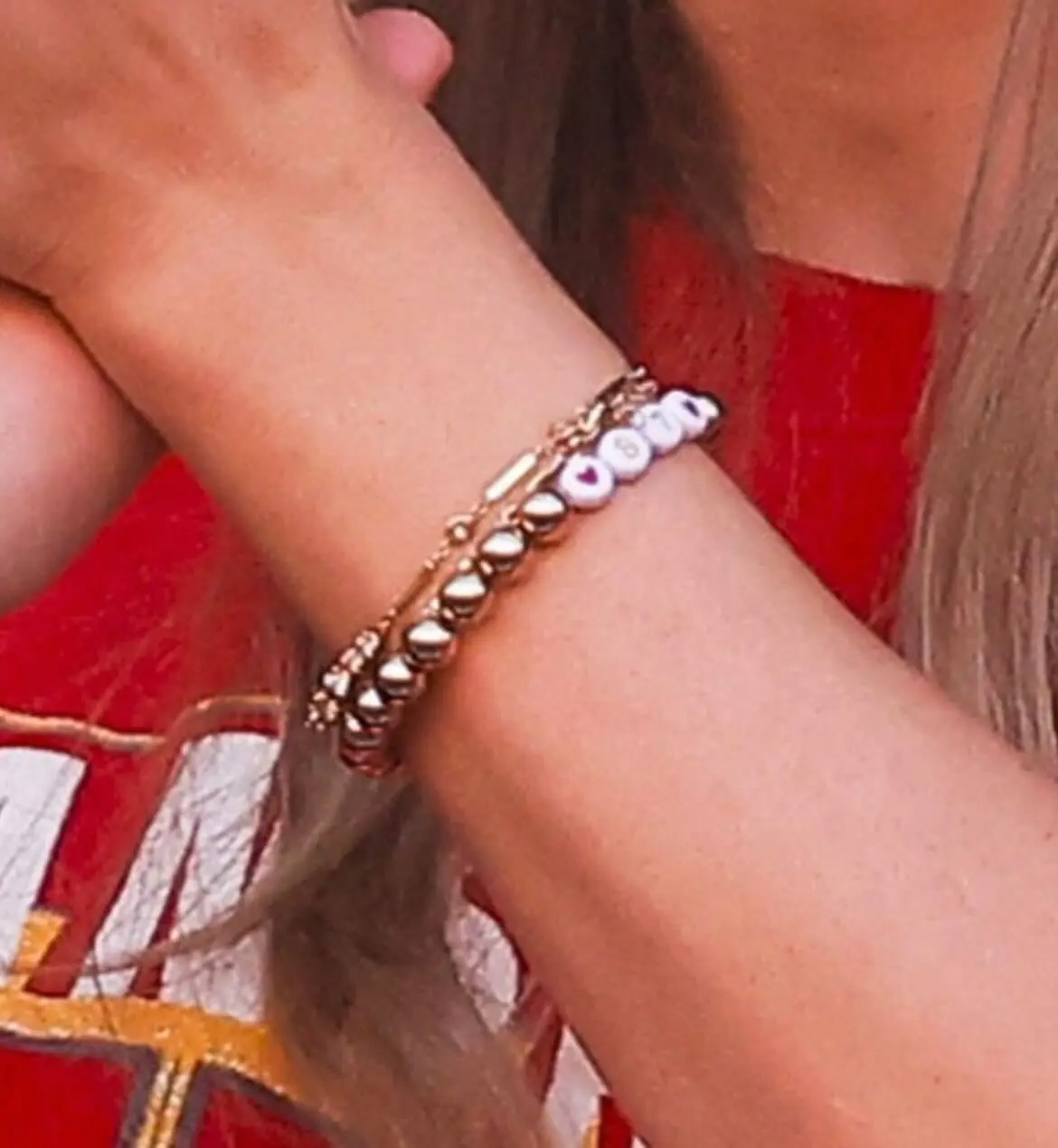 Taylor Swift wearing her heart on her wrist the 87 bracelet