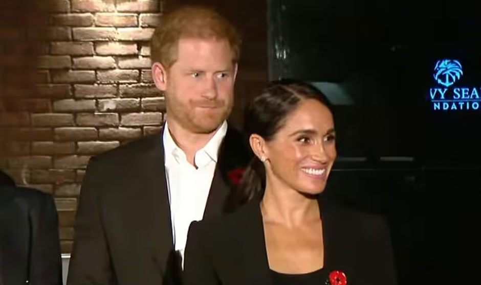 Prince Harry and Meghan Markle at the ribbon cutting ceremoby