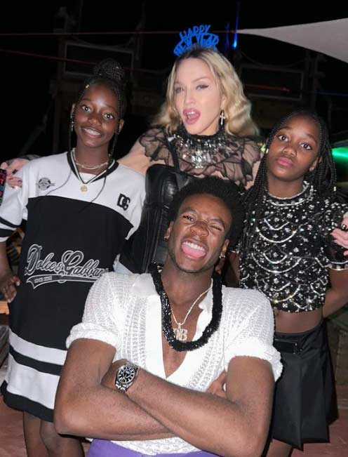 Madonna posing with  David, Stella and Estere