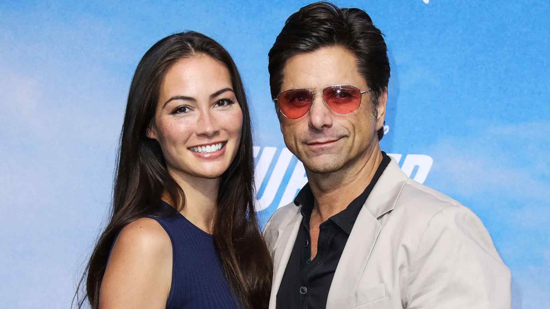 John Stamos and Caitlin McHugh dated for a year before they got engaged in 2017 at Disneyland
