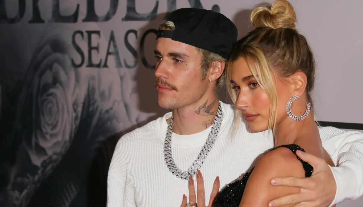 Justin Bieber was seen striking a stiff pose beside Hailey Baldwin, staring directly into the camera