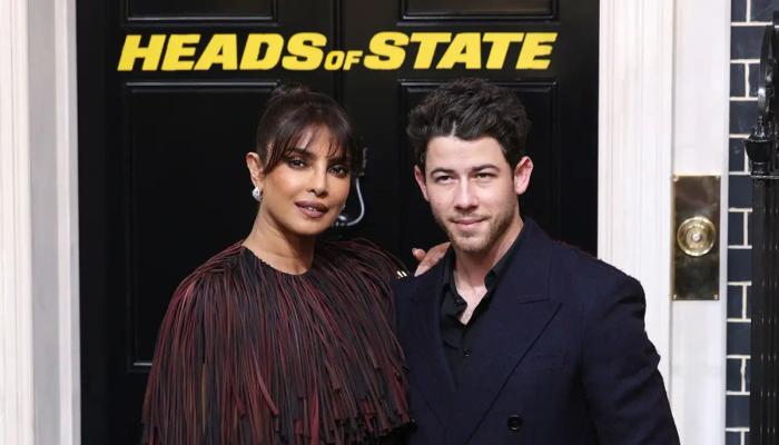 Priyanka Chopra walks red carpet with Nick Jonas in Dark Burberry Dress