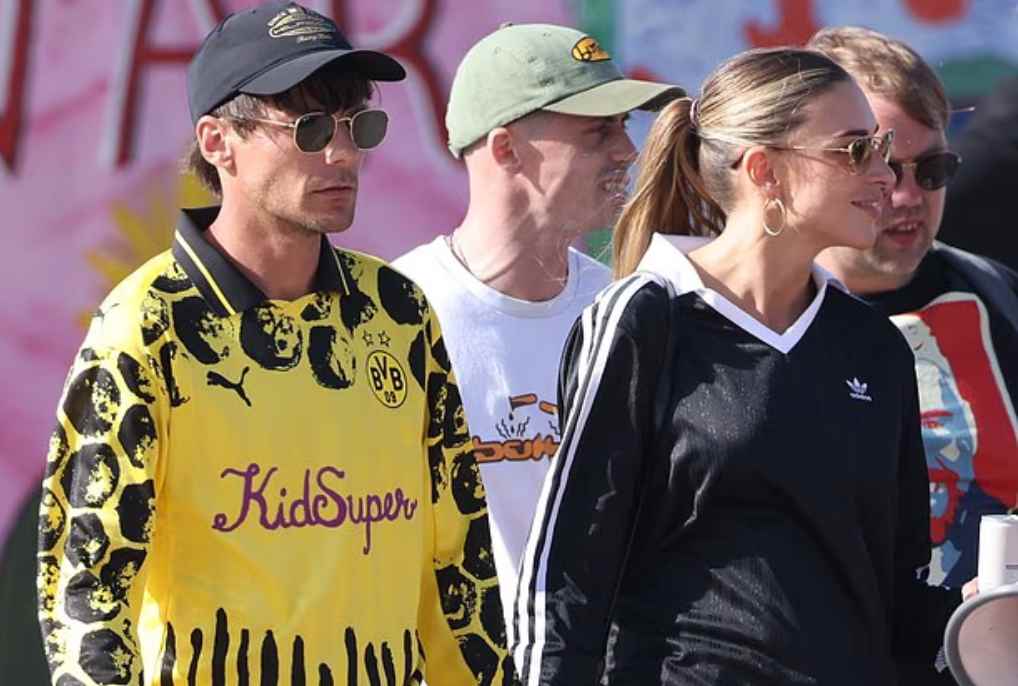 Zara McDermott cheers for beau Louis Tomlinson from crowd