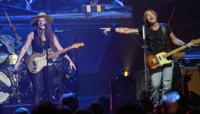 Maggie Baugh, Keith Urban onstage at the 2024 iHeartCountry Festival
