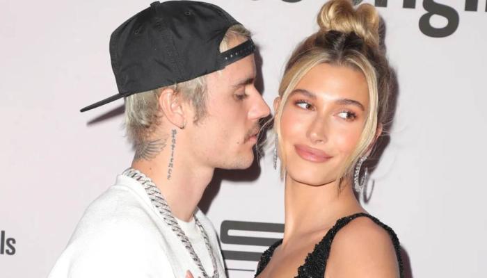 Justin and Hailey Bieber pack on PDA during adorable concert night