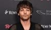 Louis Tomlinson goes against management, supports fans
